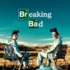 Breaking Bad poster showing two men in protective suits sitting in chairs in a desert landscape.