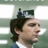 Severance poster featuring a suited man with a miniature office on top of his head.